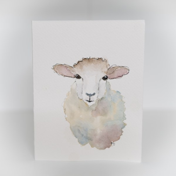 A greeting card featuring a painting of a sheep.