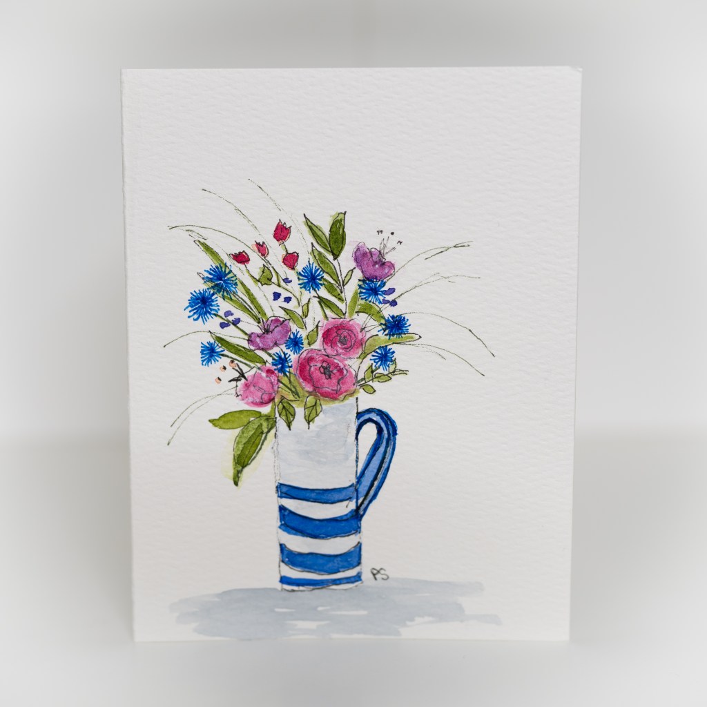 A greeting card featuring a painting of flowers in a white and blue vase.